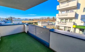 Fernwärme - Neubauwohnung mit 10m2 Balkon, Parkplatz und Grünblick