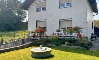 Einfamilienhaus mit großem Garten und Garage